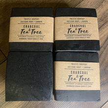 Load image into Gallery viewer, Thistle Soapery Handmade Vegan Facial Soap. Solid black charcoal soap bar. Wrapped in a recycled kraft paper sleeve.