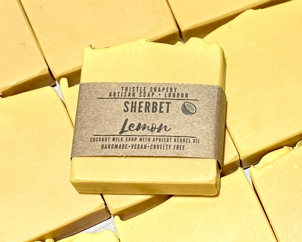 Yellow soap bar with a label on a yellow background