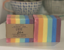 Load image into Gallery viewer, Thistle Soapery Handmade Vegan Soap. Solid rainbow striped soap; red, orange, yellow, green, blue &amp; purple.  Wrapped in a recycled kraft paper sleeve. Gay pride flag design.
